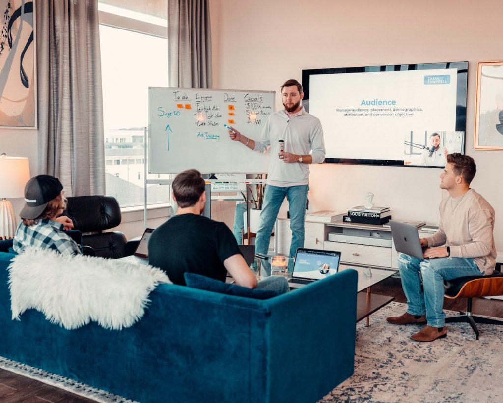 a man giving a presentation to a group of people